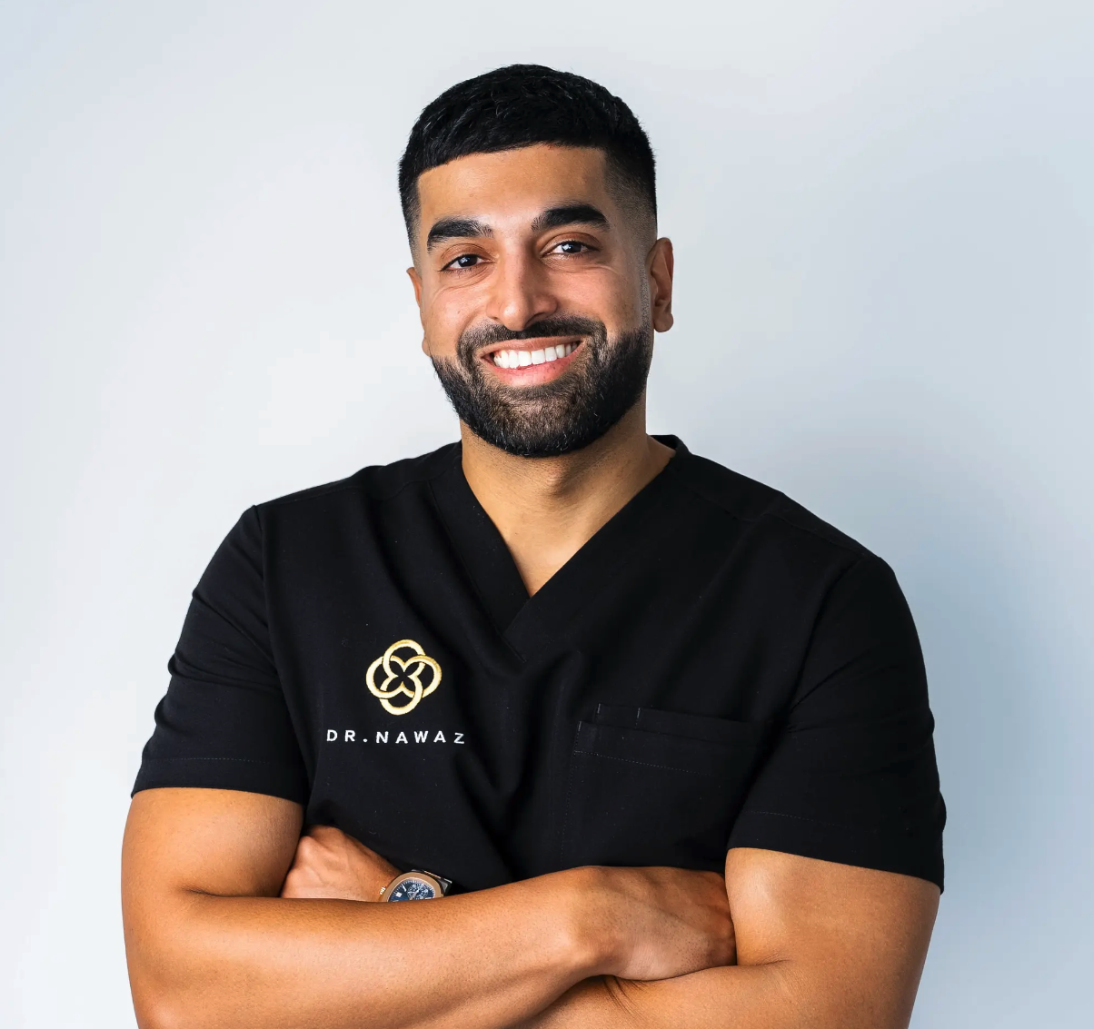 Dr Nawaz wearing his clinic scrubs